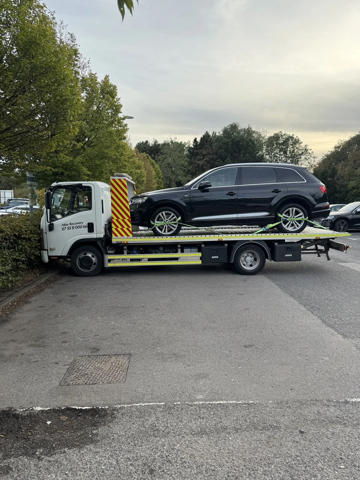Atlas Recovery truck carrying an Audi